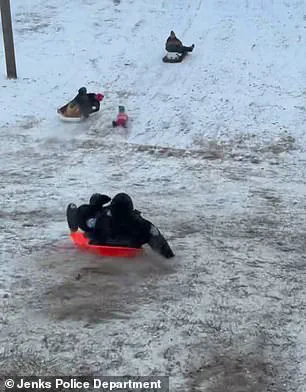 Limited Access Footage Reveals Officer's Unusual Sledding Mishap During Oklahoma Snow Day