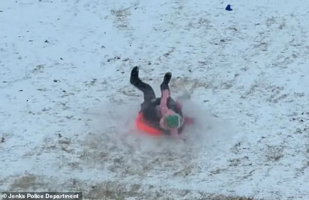 Limited Access Footage Reveals Officer's Unusual Sledding Mishap During Oklahoma Snow Day