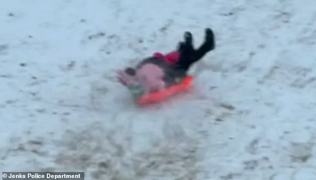 Limited Access Footage Reveals Officer's Unusual Sledding Mishap During Oklahoma Snow Day