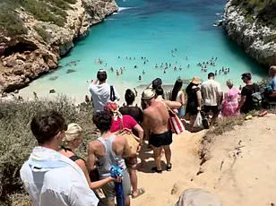 Viral Fame Turns Hidden Gem into Chaos: Mallorca Beach Owners Seek to Seal Off Overrun Cove