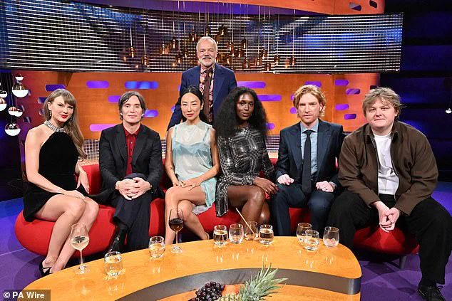 Taylor Swift and Domhnall Gleeson Star in Surreal Nineties-Themed Video Featuring Magical Opalite Spray