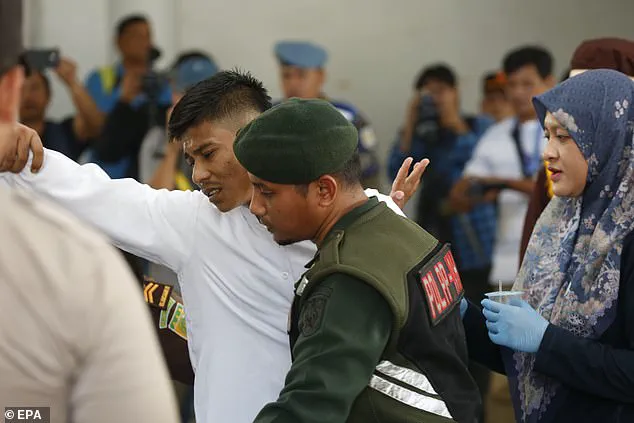 Two men publicly flogged for gay sex in Indonesia