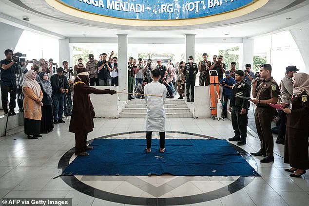 Two men publicly flogged for gay sex in Indonesia