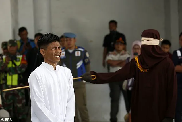 Two men publicly flogged for gay sex in Indonesia
